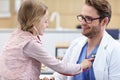 Little girl in clinic having a checkup with pediatrician Royalty Free Stock Photo