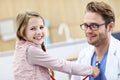 Little girl in clinic having a checkup with pediatrician Royalty Free Stock Photo