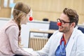 Little girl in clinic having a checkup with pediatrician Royalty Free Stock Photo