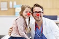 Little girl in clinic having a checkup with pediatrician Royalty Free Stock Photo