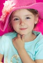 Little girl closeup in pink summer hat. Beautiful smiling face. Royalty Free Stock Photo