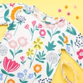 Little girl clothing and accessories - pretty dress, sandals, sunglasses. Baby summer fashion concept. Royalty Free Stock Photo