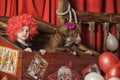 The little girl the clown and the trained dog in the circus