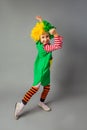 The little girl in a clown uniform has fun Royalty Free Stock Photo