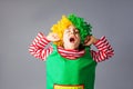 The little girl in a clown uniform has fun Royalty Free Stock Photo