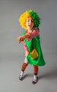 The little girl in a clown uniform has fun Royalty Free Stock Photo