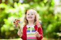 Little girl with colorful candy lollipop Royalty Free Stock Photo