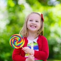 Little girl with colorful candy lollipop Royalty Free Stock Photo