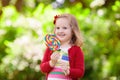 Little girl with colorful candy lollipop Royalty Free Stock Photo