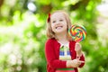 Little girl with colorful candy lollipop Royalty Free Stock Photo