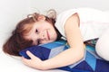 Little girl on a colorful pillow Royalty Free Stock Photo