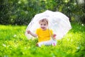 Little girl with colorful umbrella playing in the rain Royalty Free Stock Photo