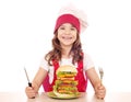 Little girl cook with big hamburger Royalty Free Stock Photo