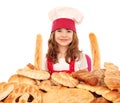 Little girl cook with bread buns pretzels and rolls Royalty Free Stock Photo