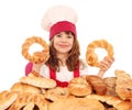 Little girl cook with bread buns and rolls Royalty Free Stock Photo