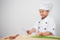 Little girl cook,children chef afraid of vegetables Royalty Free Stock Photo