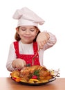 Little girl cook eat chicken