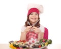 Little girl cook with prepared trout ready for lunch Royalty Free Stock Photo