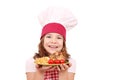 Little girl cook with roasted chicken wings franch fries a