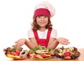 Little girl cook with salmon seafood Royalty Free Stock Photo