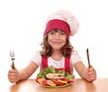 Little girl cook with salmon seafood Royalty Free Stock Photo