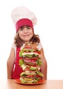 Little girl cook and tall sandwich