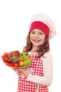 Little girl cook with turkey drumstick Royalty Free Stock Photo