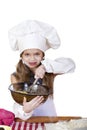 Little girl cook whips whisk eggs in a large plate Royalty Free Stock Photo