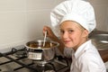 Little girl cooking Royalty Free Stock Photo
