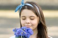 Little girl cornflowers bouquet holiday greetings, fresh fragrance concept