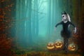 Little girl in a costume of witch posing with pumpkins over fairy background. halloween Royalty Free Stock Photo