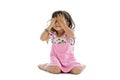 Little girl covering her eyes