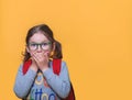 Little girl covering her mouth with hands and make big eyes. Surprised or scared kid. Shocked upset child for mistake Royalty Free Stock Photo