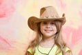 Little girl in cowboy hat on colorful background, copy space Royalty Free Stock Photo