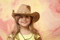 Little girl in cowboy hat on colorful background, copy space Royalty Free Stock Photo