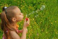 Little girl creates bubbles