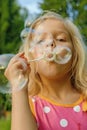 Little girl creates bubbles