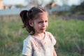 The little girl cries heavily outdoors. Children offense