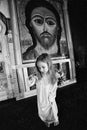 little girl with a cross in the Orthodox Church