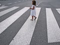 Little girl crossing street