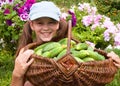 Little girl and cucumbers