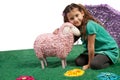 Little girl cudddling a toy sheep Royalty Free Stock Photo