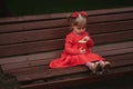 Little girl with cup of popcorn in park Royalty Free Stock Photo