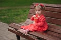 Little girl with cup of popcorn in park Royalty Free Stock Photo