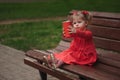 Little girl with cup of popcorn in park Royalty Free Stock Photo