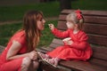 Little girl with cup of popcorn in park Royalty Free Stock Photo