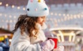 little girl with cup of tea over christmas market Royalty Free Stock Photo