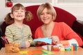 Little girl cutting with scissors