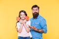 Little girl and dad hold colorful lollipop. summer vibes. happy family. cheerful about dessert. candy shop. happy Royalty Free Stock Photo