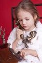 Little girl dails a number on phone Royalty Free Stock Photo